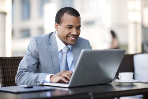 African-American businessman working on his laptop.