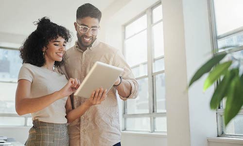 woman and man looking at a document together